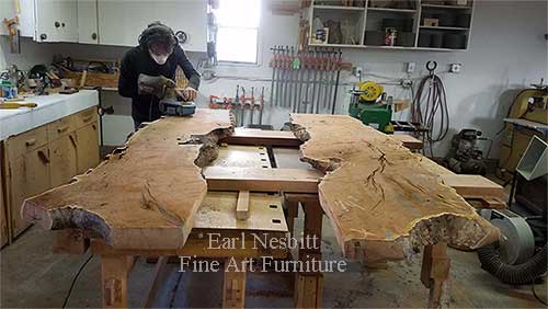Earl rough sanding mesquite slabs for custom made live edge dining table
